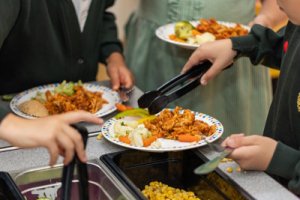 Children serving their own food at the salad bar