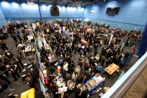 Aerial image of a busy exhibition hall full of stands